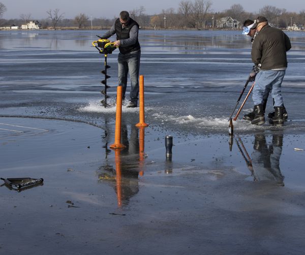 Tush Dip cutting the hole in the ice