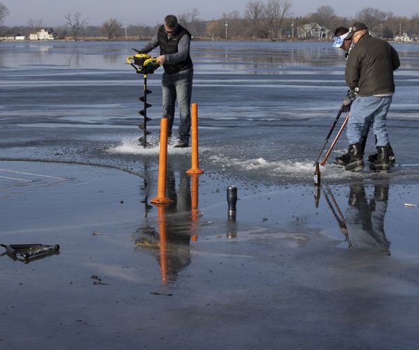 Tush Dip cutting the hole in the ice